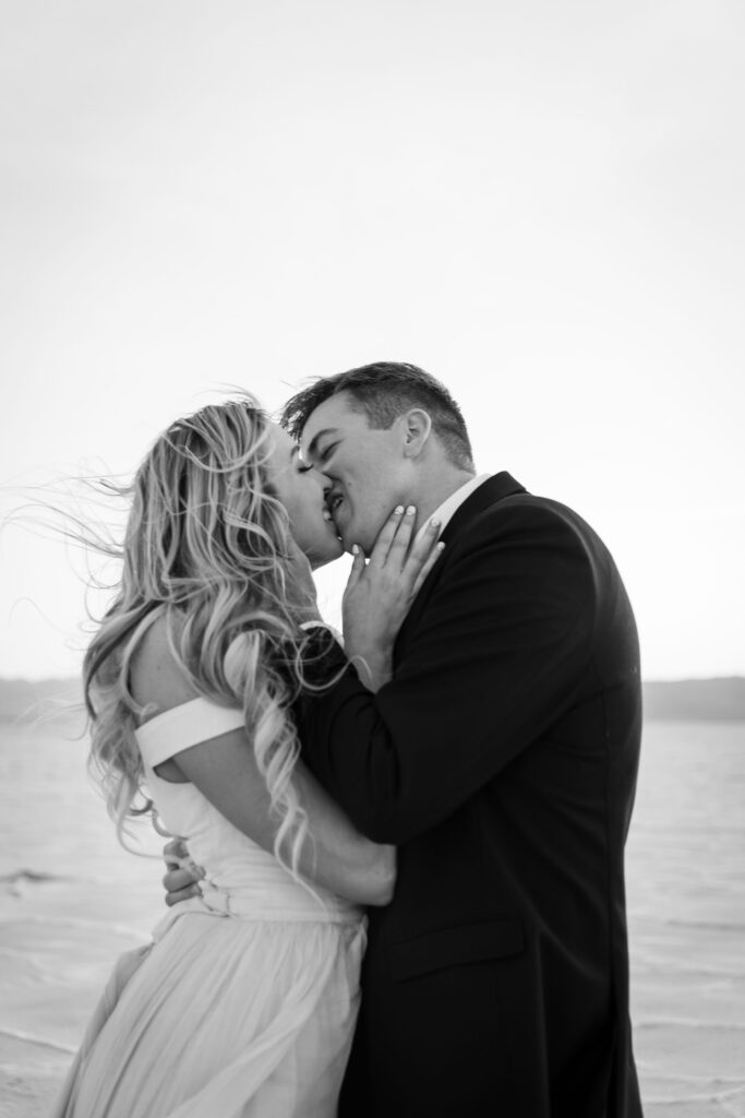 Bride and groom kissing during elopement in Utah’s Bonneville Salt Flats