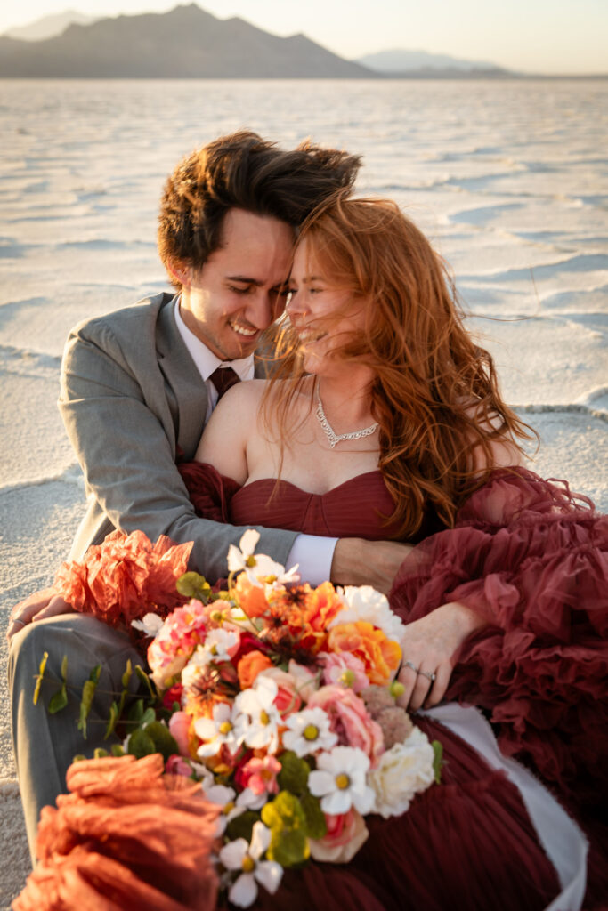 Candid moment of bride and groom smiling at each other during Salt Flats elopement
