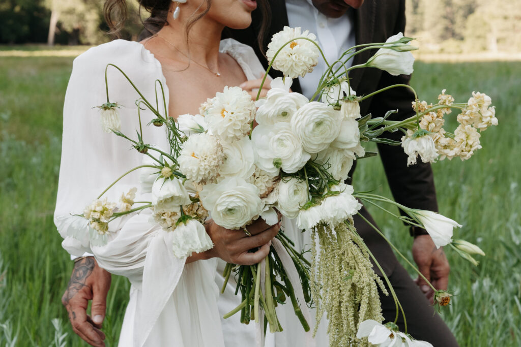 Romantic flower arrangement with earthy greens and soft whites