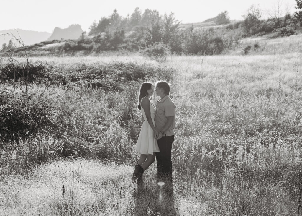 Groom-to-be looking at fiancée during Columbia River Gorge photo shoot