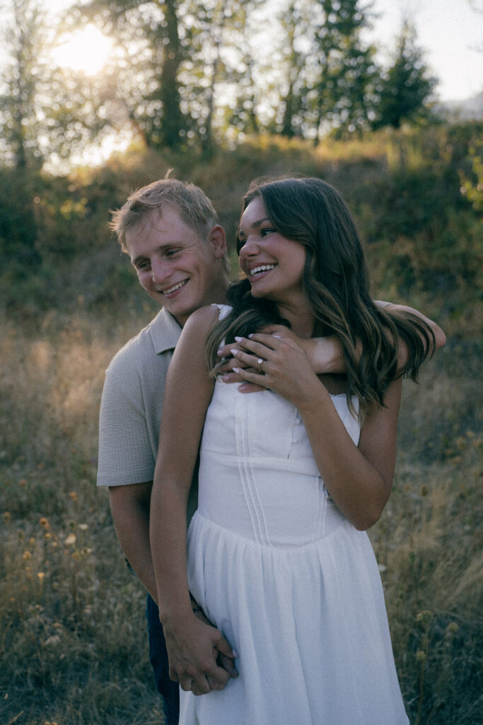 Rustic country-inspired engagement photo with casual outfits
