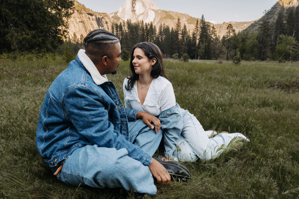 Couple leaning in for kiss in denim outfits