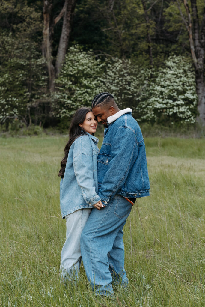 Outdoor engagement portrait with rustic tree background
