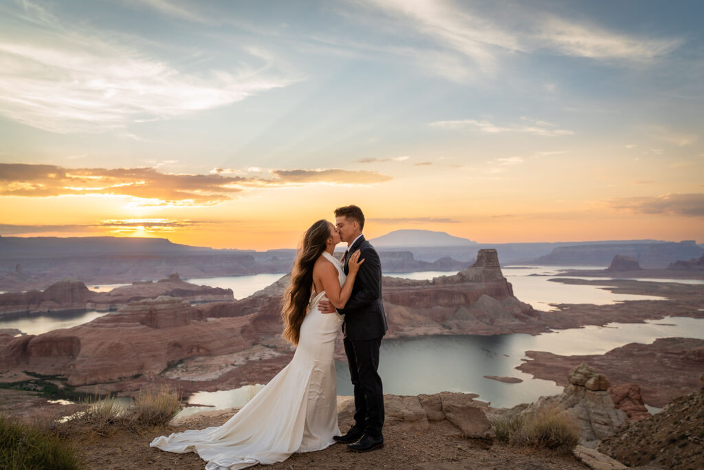 Intimate sunset kiss overlooking the cliffs of Alstrom Point.