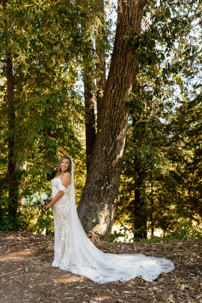 Bride’s dress catching sunlight in an outdoor setting