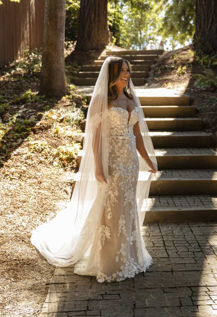 Bride’s dress catching sunlight in an outdoor setting