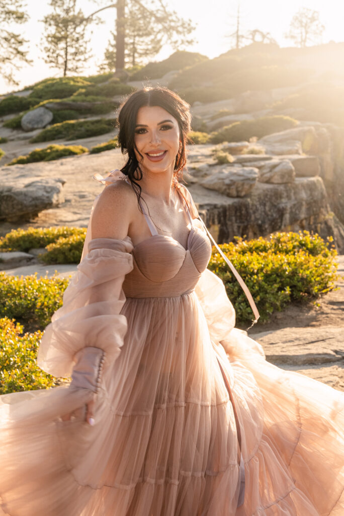 Bride smiling in chiffon dress at golden hour