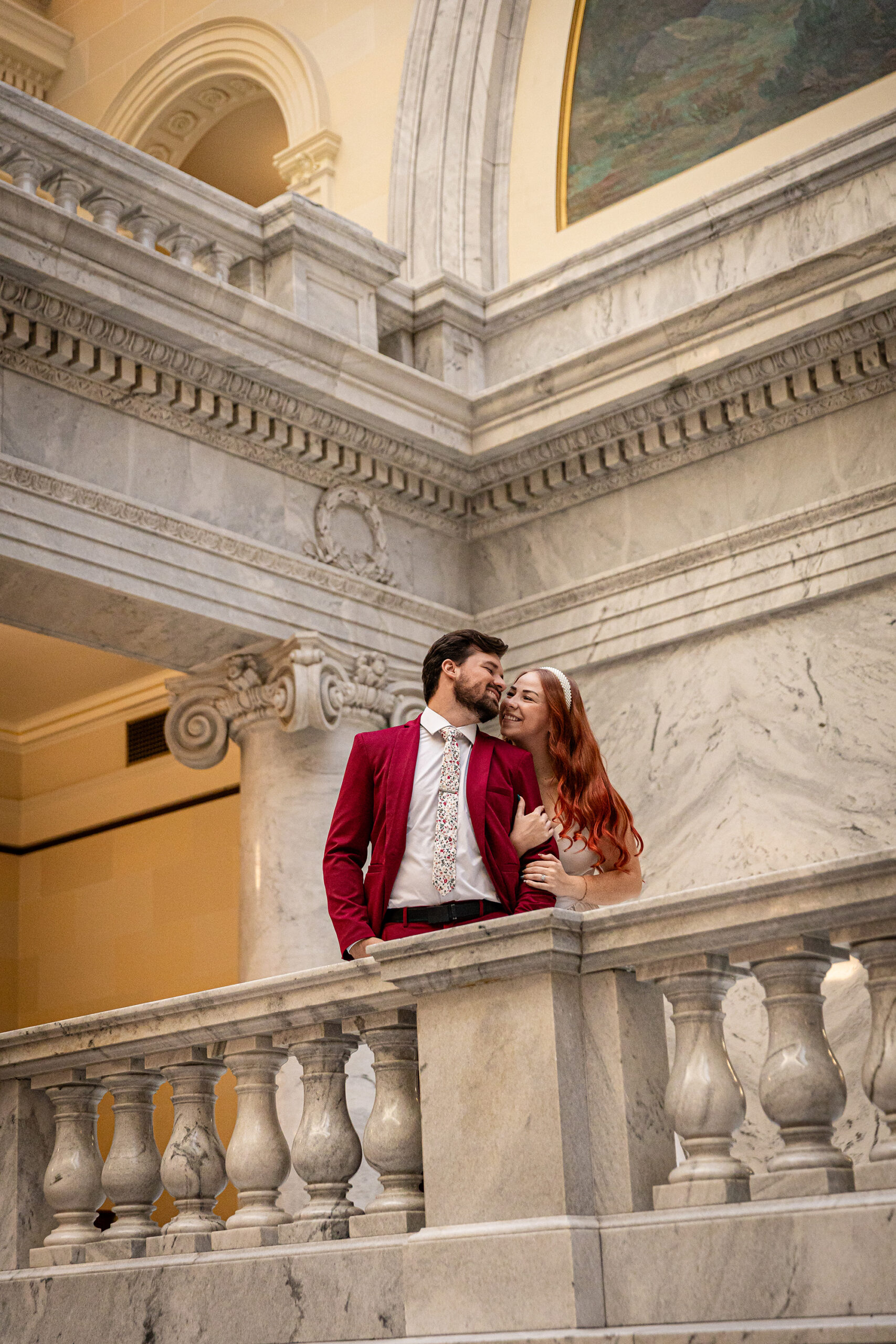 Bride and groom posing beneath the grand dome — cinematic Utah State Capitol elopement session.