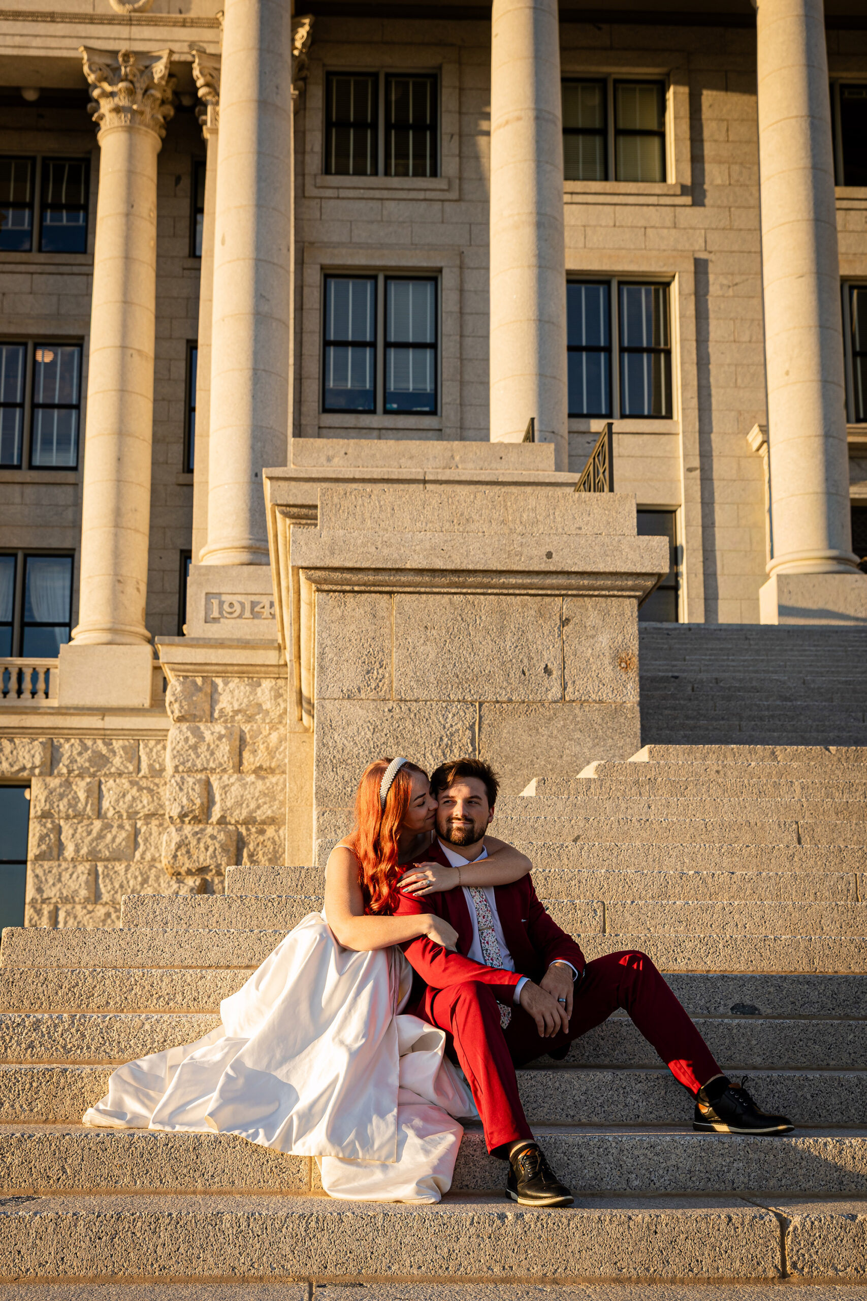 Bride and groom during their courthouse wedding at the Utah State Capitol in Salt Lake City — elegant elopement formal session captured by Honey I Do, Utah wedding photographer.